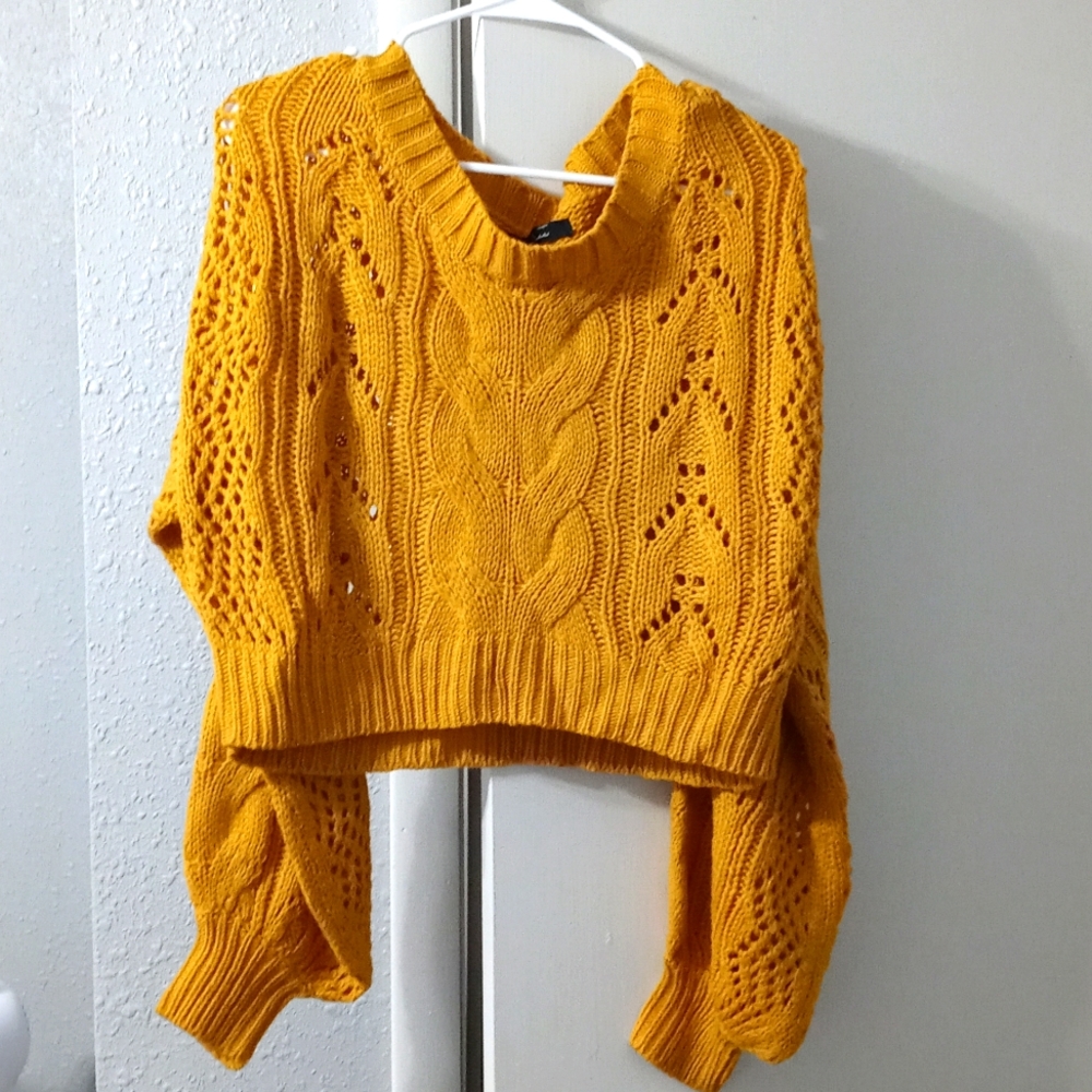 Mustard Yellow crop sweater with overlarged sleeves.